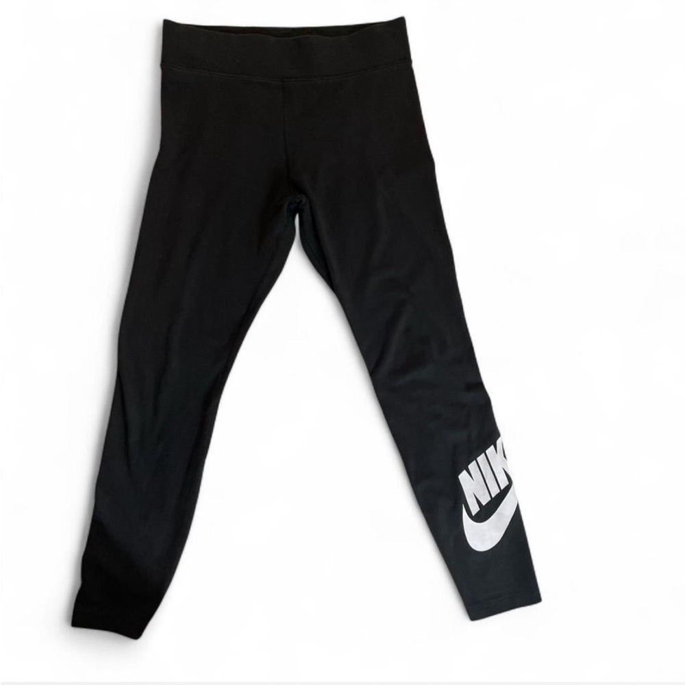 Black Nike leggings with white logo on the leg